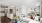 Luxury studio apartment at The Beverly Collection showing open floor plan with modern kitchen, cozy living area, and spacious bedroom nook