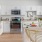 a kitchen with white cabinets