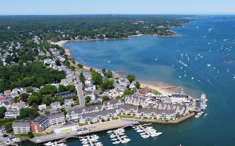 a body of water with boats in it and buildings around it