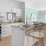 a kitchen with white cabinets