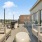 a patio with chairs and tables