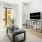 a living room with a tv and couches