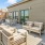 a patio with chairs and tables